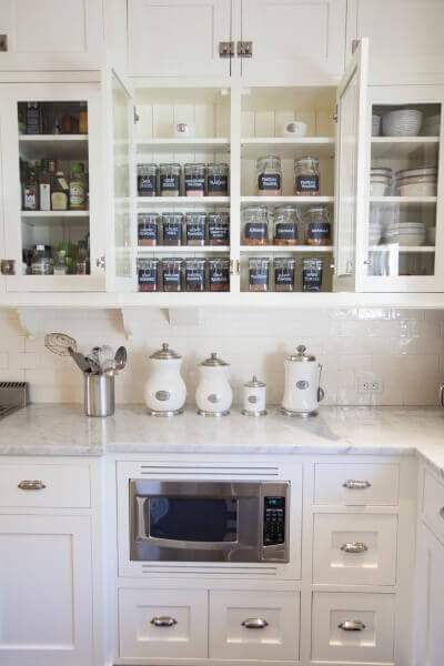 3) Organized Cabinets with White Backsplash
